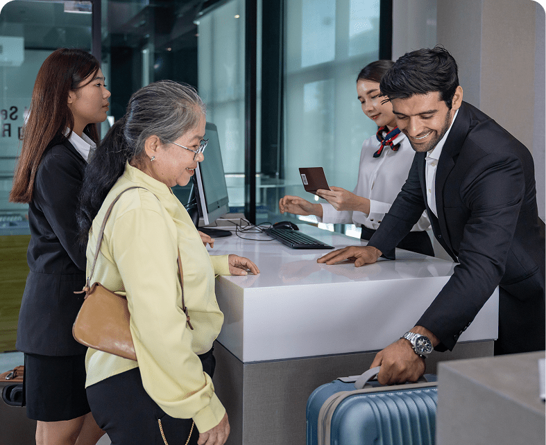People checking in at airport counter