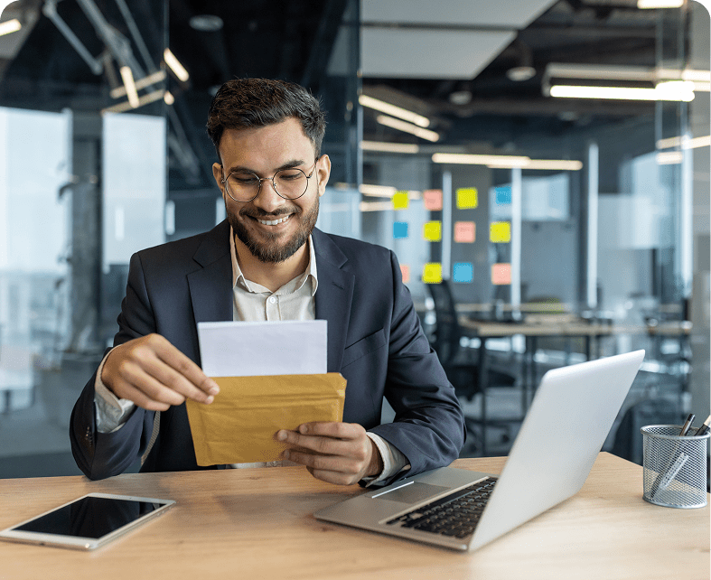 Smiling man with laptop and tablet
