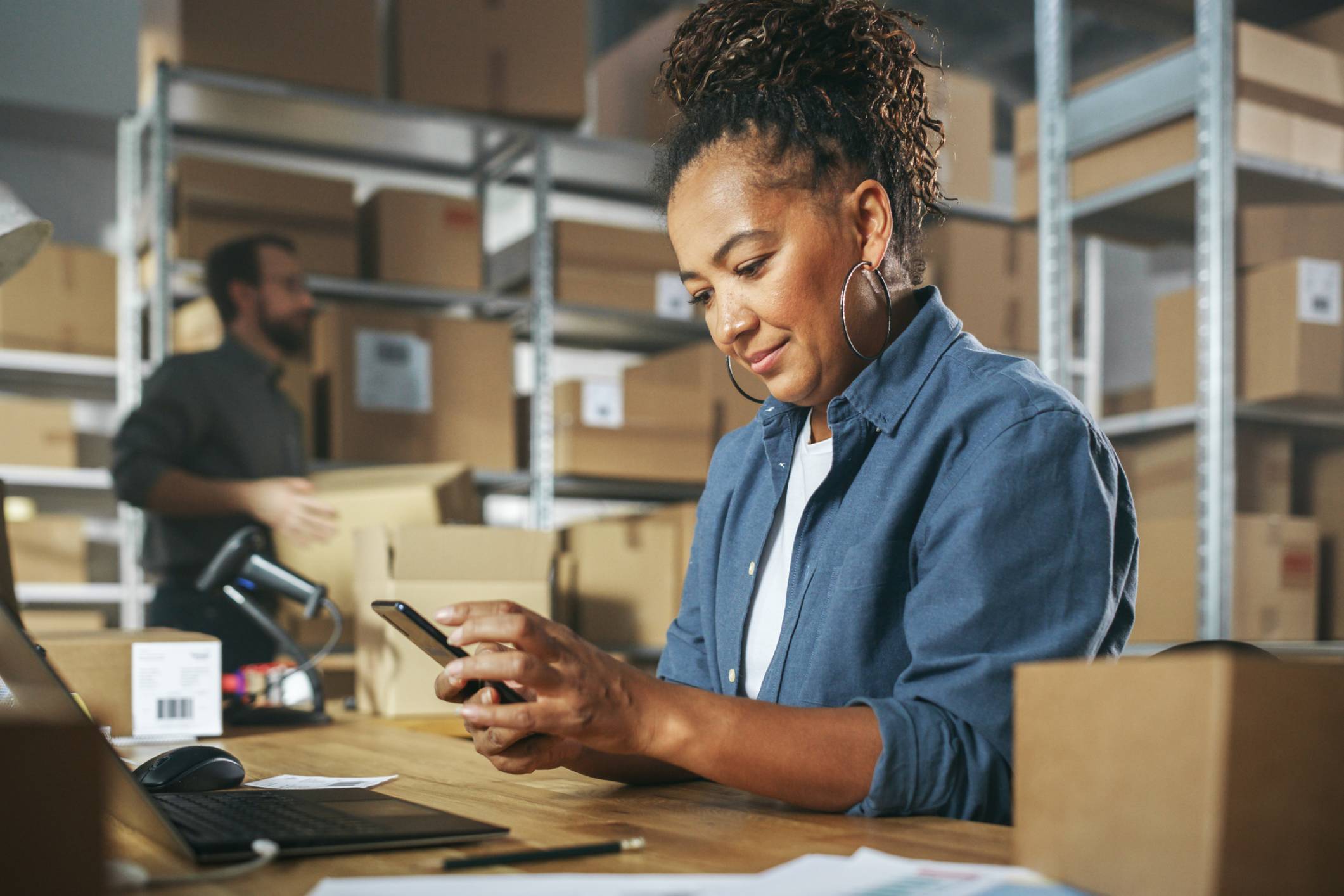 Employee managing orders on mobile device