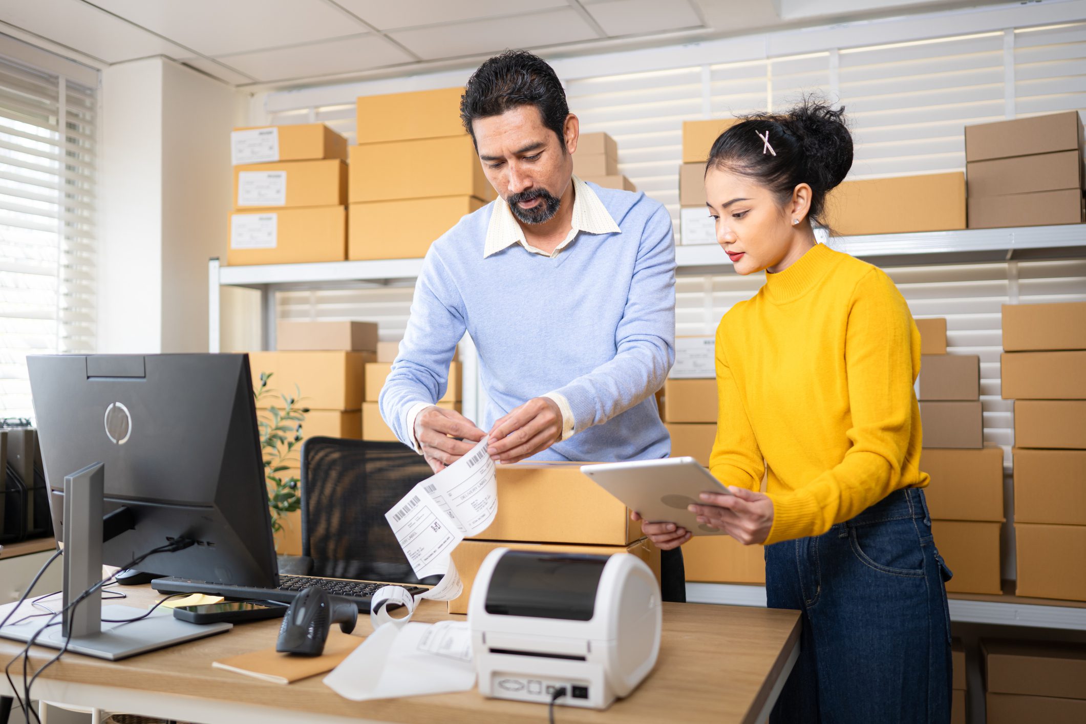 Colleagues working with shipping labels