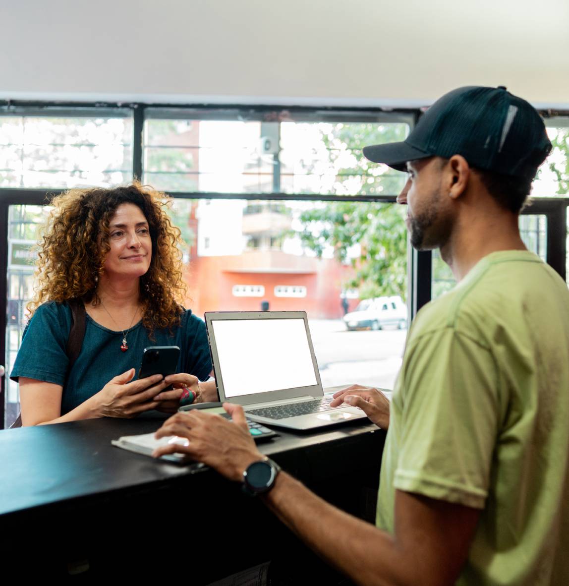 Woman checking in with receptionist