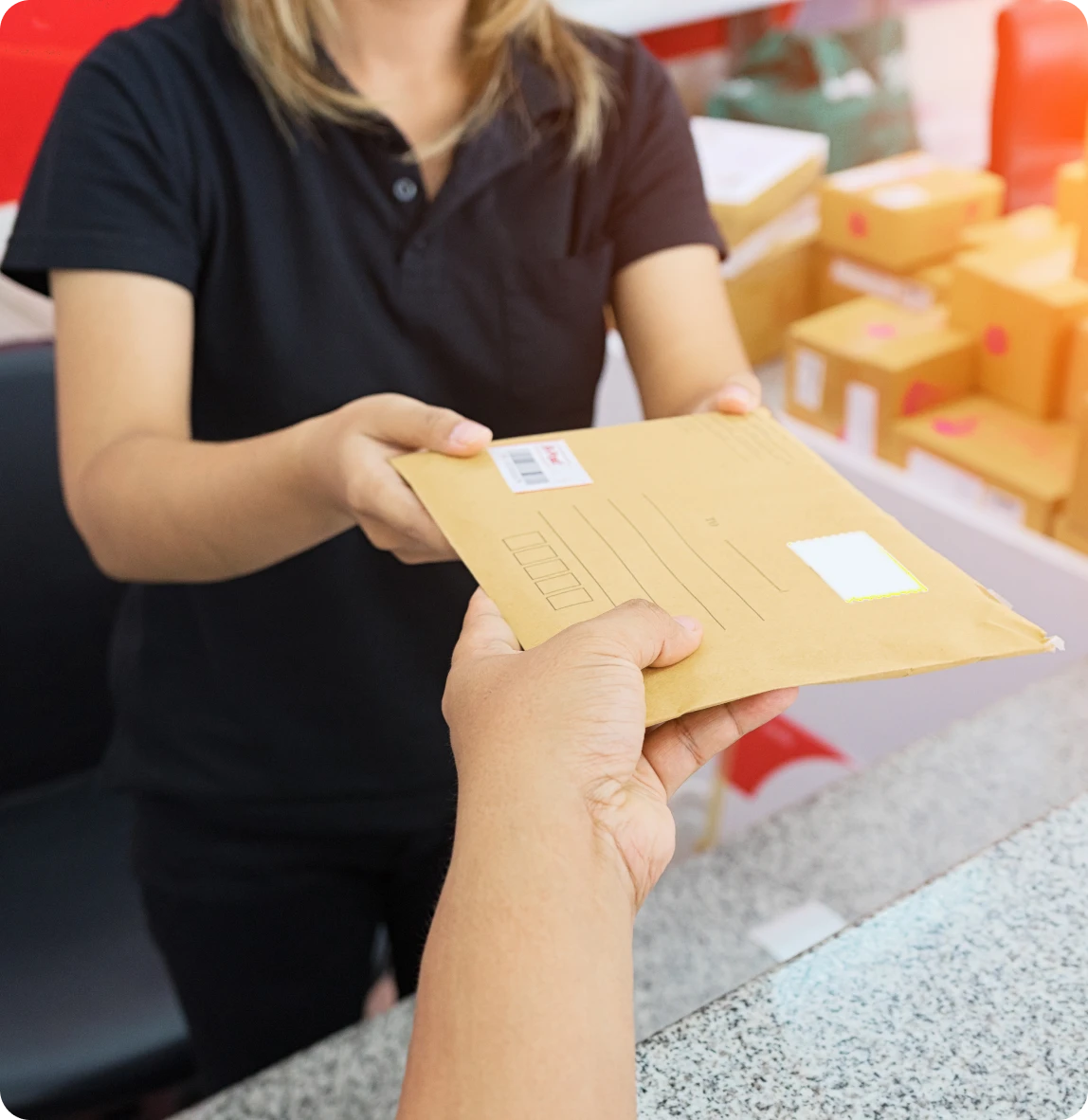 Postal worker giving a package