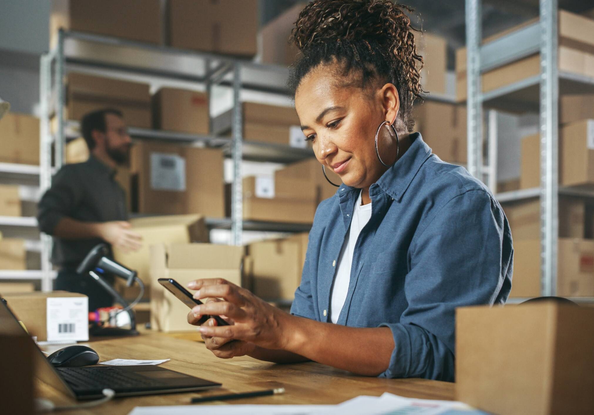 Employee managing orders on mobile device